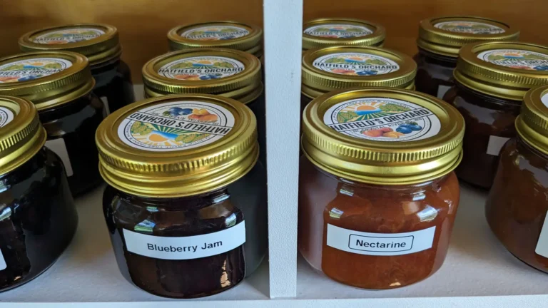 Jars of Blueberry Jam and Nectarine Jam on the shop shelf